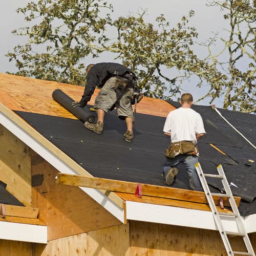 Roofers install roof.